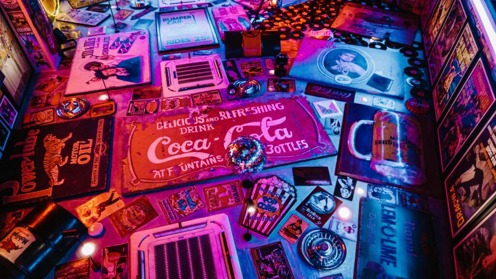 pexels-photo-1601773-1601773 Colorful retro signage and vintage Americana decor in a captivating artistic layout with vibrant lighting.